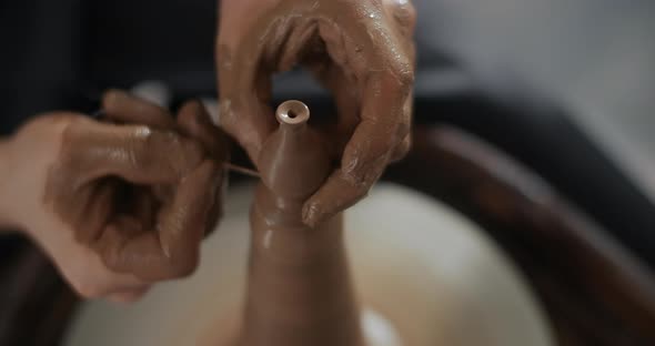 Potter Sculpts a Tiny Ceramic Jug in Slow Motion on a Potter's Wheel Small Forms in Pottery Potter