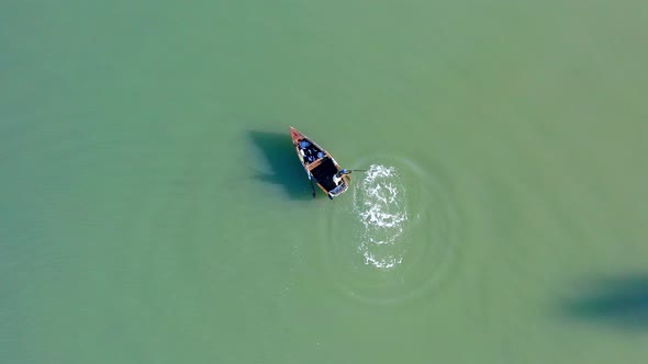 Fisherman in Soco River mouth with fishing criminal method, Dominican Republic. Aerial top-down dire