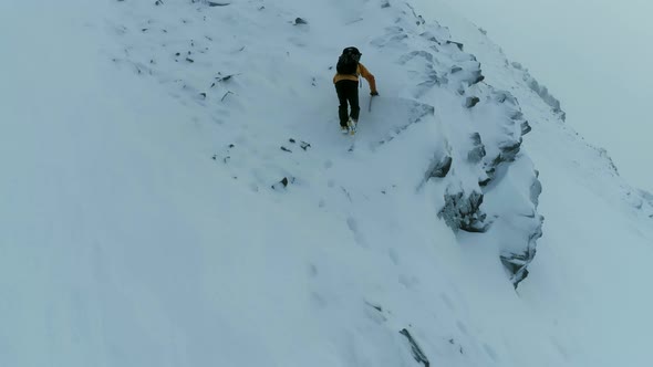 Mountain Climber Ascending a Difficult Rock Face