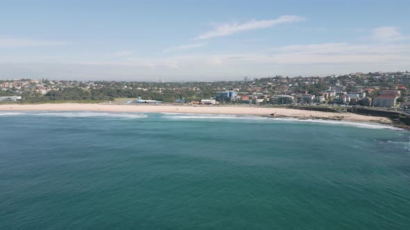 Aerial low flying forward shot of Maroubra Beach in the Easter Suburb of Sydney, New South Wales, Au