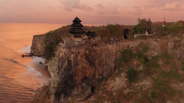 Aerial Drone Flight Over Fantastic Sunset at Pura Luhur Uluwatu Temple Bali Indonesia