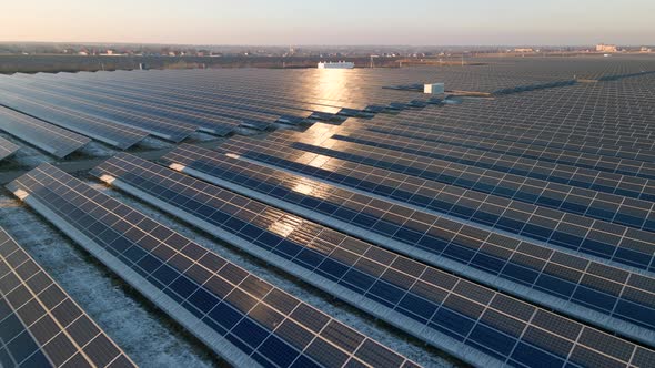 Aerial View of Solar Panels Stand in a Row in the Fields Power Ecology Innovation Nature Environment