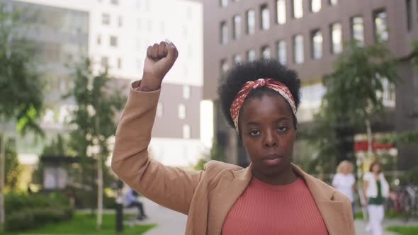  Black Woman Holding Up Hand in Protest