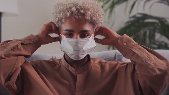 African Woman Wearing Disposable Facial Medical Protective Respirator Mask