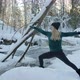 Yoga Woman Practice Pose in Snowy Winter Forest Nature Near Flowing River - VideoHive Item for Sale