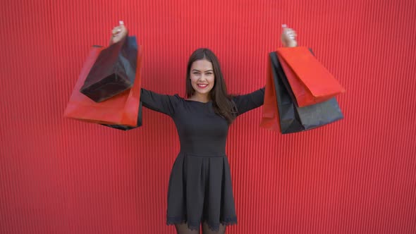 Black Friday, Portrait of Happy Customer Girl with Purchases Into Shopping Bags During Sales Season