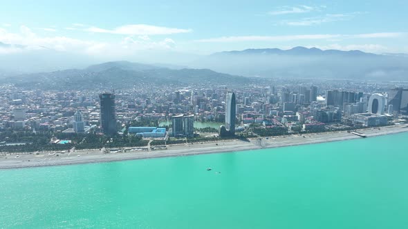 Aerial view of beautiful lake in the center of Batumi. flying over 6 May park. Georgia 2022 summer