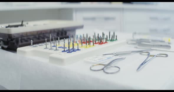 A Dentist's Table Prepared for Work with Dental Instruments Laid Out on It