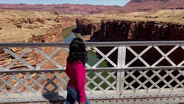 Asian woman enjoying the view of the Colorado River