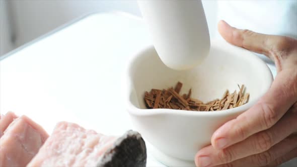 Close-up of person using mortar and pestle to grind ingredients