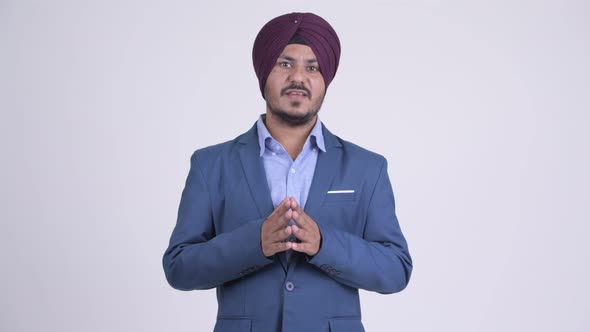 Bearded Indian Sikh Businessman Explaining Something