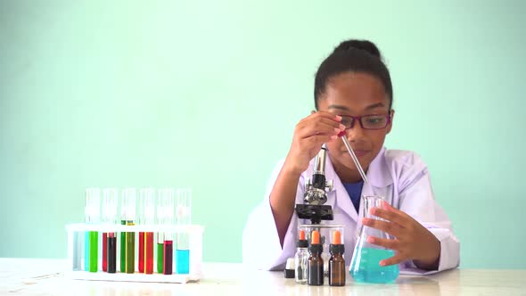 Young African American Kid Doing Chemistry Experiment