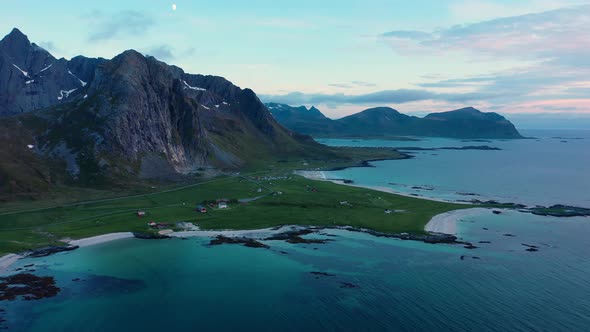 Fly over the sea and view on Flakstad and Skagsanden beach,Lofoten Islands