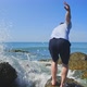 Guy Climbs Up on Wet Rock - VideoHive Item for Sale