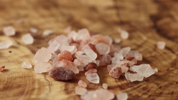 Pink Himalayan rock salt passes in front of the camera