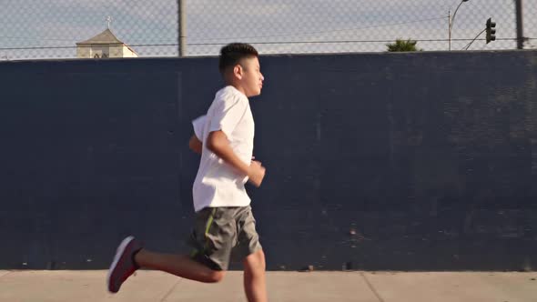 Boy Running On School Track