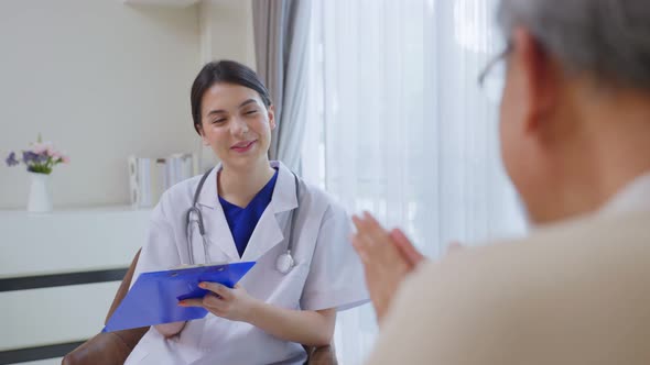 Asian Senior elderly man patient consulting and explain life problems to psychology doctor in house.