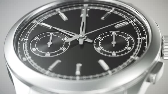 Closeup on the luxury watch with gears and mechanism visible through the glass.