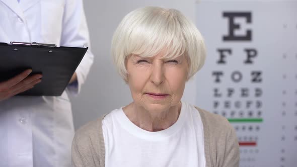 Aged Lady Visiting Oculist, Doctor Writing Recommendations, Elderly Sight Care