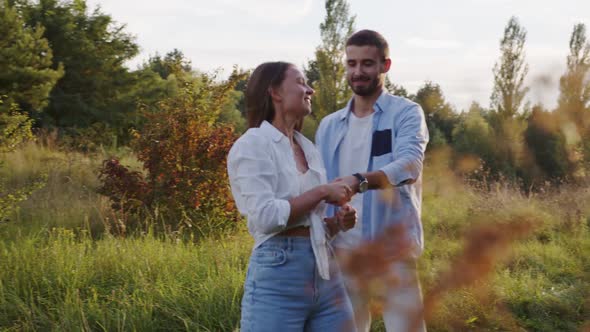 Romantic Funny Couple Walking in Park