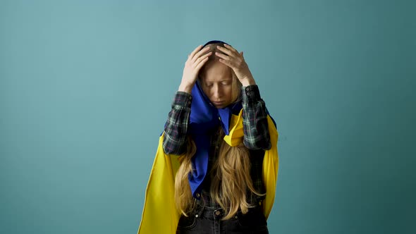 Young Woman with Ukrainian Flag on Head