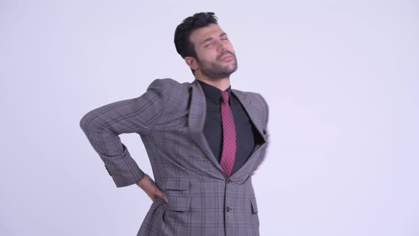 Stressed Bearded Persian Businessman Having Back Pain