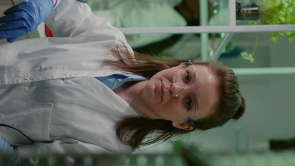 Vertical Video Portrait of Chemist Woman in White Coat Working in Pharmaceutical Laboratory