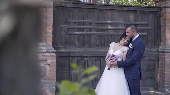 Pretty Bride in Long Dress Leans on Husband Slow Motion