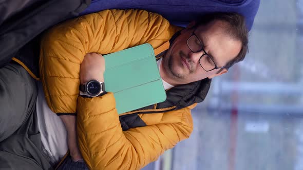 Mature Exhausted Male Sleeps in Subway After Work Hugs Tablet Pc