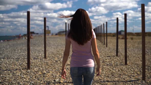 Young and Attractive Girl or Young Woman in Pink T-shirt Walking Away Than Turn Around and Follow Me