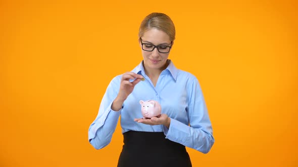 Smiling Business Lady Putting Coin Piggybank Bright Background, Bank Deposit