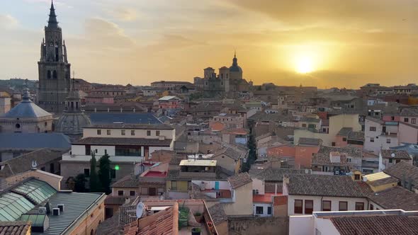 Parallax of Toledo Spanish city center with epic golden sunset behind. 4K