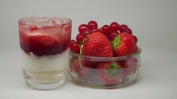 Strawberries And Grapes In A Glass Bowl Together With Delicious Strawberry Shake In A Turntable - Cl