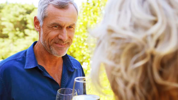 Mature couple interacting with each other in balcony