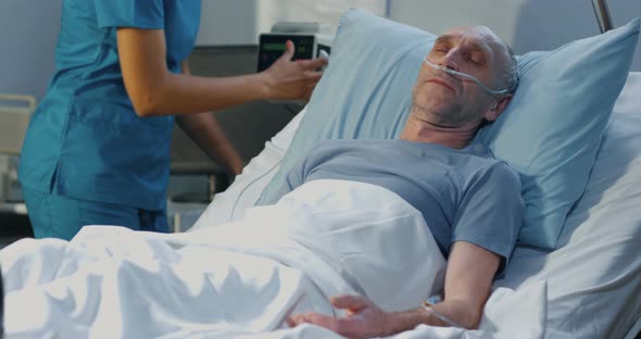 Man Lying in Hospital Bed