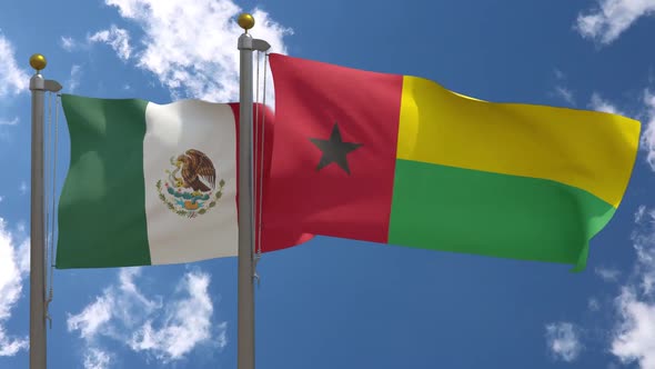 Mexico Flag Vs Guinea Bissau Flag On Flagpole