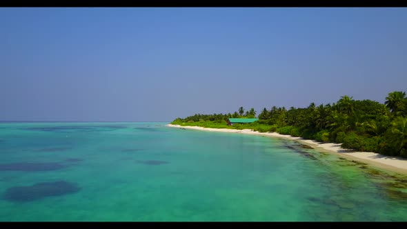 Aerial flying over abstract of relaxing island beach holiday by clear sea with bright sandy backgrou