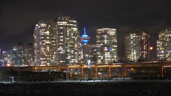 Vancouver Lookout - Harbour Centre Skyscraper With High-rise Building Illuminated At Night In Centra