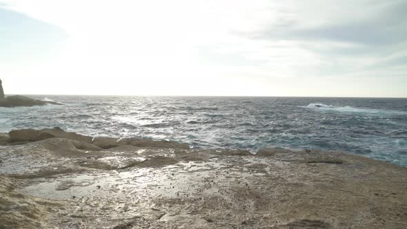 Turquoise Colour Sea Washes Shore of Gozo Island near Azure Window