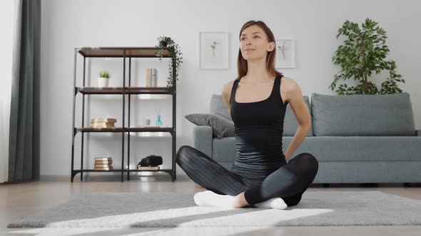 Woman Doing Stretching on Floor