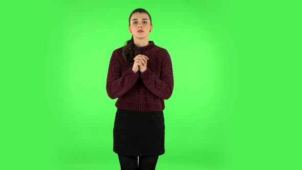 Woman Looking at Camera with Anticipation, Then Very Upset. Green Screen
