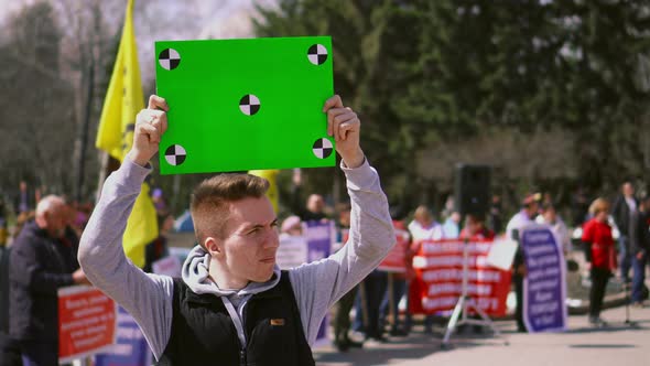 Man on Demonstration Standing Hold Track Points Chroma Key Billboard. Angry