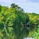 Boathouse on the edge of Rowe's Flashe Lake at Winkworth Arboretum, in Surrey, England, UK. - VideoHive Item for Sale