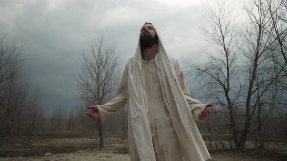 Jesus Christ or Religious Man In Robes Praying