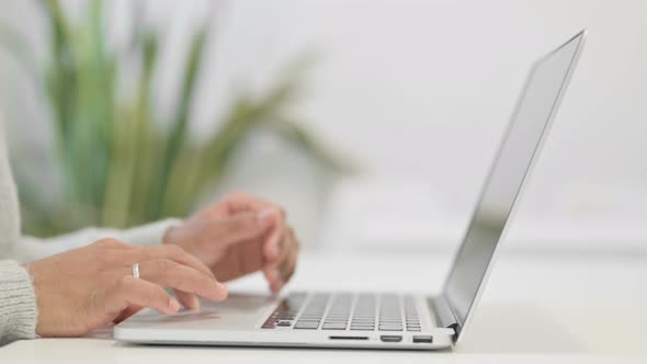 Close Up of Hands of African Woman Typing on Laptop