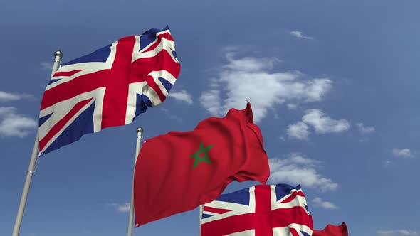 Flags of Morocco and the United Kingdom on Sky Background alt