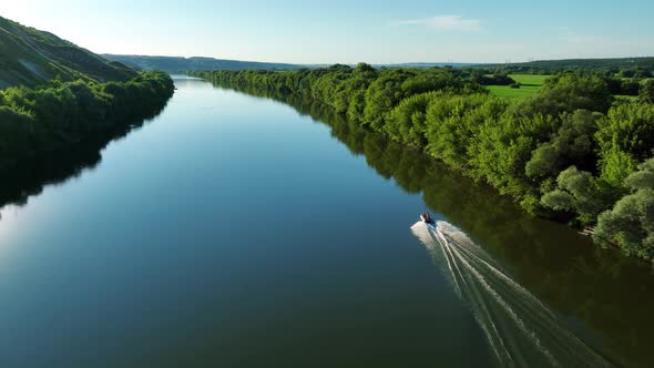 Aerial Video Footage of an Inflatable Boat Floating on the River