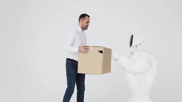 the Robot Delivers the Package Box. Cybernetic System Today. Modern Robotic Technologies. Humanoid