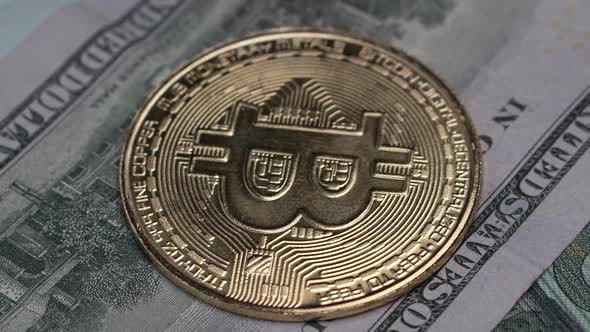 Bitcoin Golden Coin on One Hundred US Dollar Banknote, Close Up. Cryptocurrency Banking