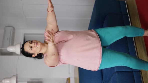 Brunette Young Woman in Sportswear Exercising to Lose Weight Practicing Squats at Home